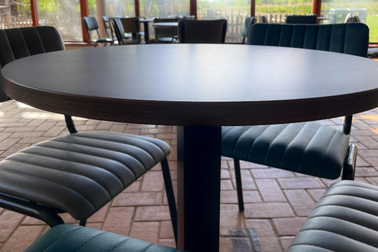 profile of a walnut effect dining table top