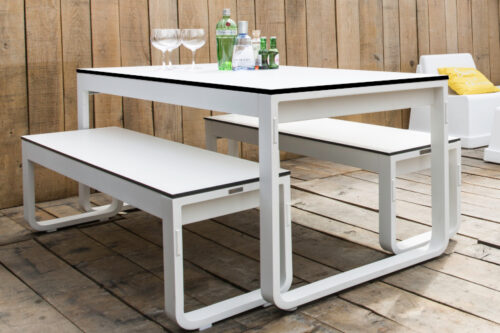 switch all weather folding dining table and bench with white frames and white high pressure laminate table top