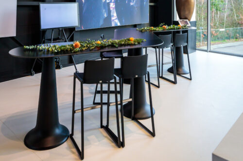 kasar bar stools in black paired with a black poseur table in an event space