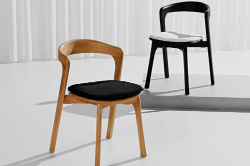 Nina side chairs, black with white seat pad and oak with black seat pad, side by side from Flexfurn