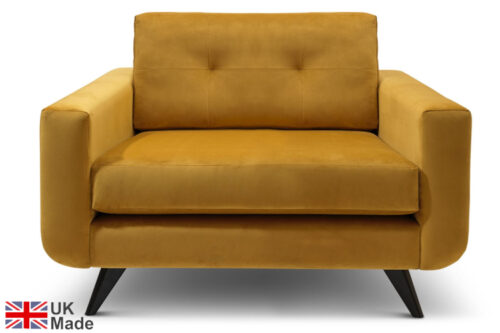 Wynn armchair in a yellow velvet on a white background.