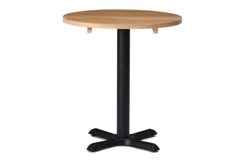 Cruciform dining table base in black, with round solid wooden table top in oak, on a white background.
