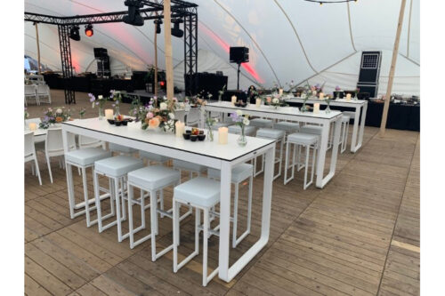 Kubo bar stools with the Switch poseur tables, white, at a festival.
