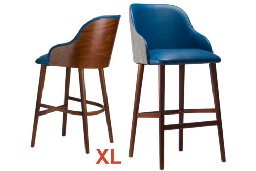 Front view of a bar stools, side by side with arms. Both with blue faux leather and Walnut stained legs. One with an upholstered back, the other wooden back, both on a white background.